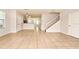 Open living room featuring tile floors and a staircase leading to the upper level at 2305 Chatham Place Dr, Orlando, FL 32824
