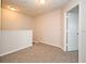 Cozy loft featuring neutral carpeting, a half-wall, and ample natural light at 2305 Chatham Place Dr, Orlando, FL 32824
