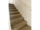 Close-up of the carpeted staircase, illustrating the home's attention to detail and comfortable transition between floors at 2305 Chatham Place Dr, Orlando, FL 32824