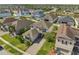 Aerial view of a well-manicured property in a residential community, featuring lush green lawns at 2348 Pearl Cider St, Orlando, FL 32824