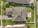 Aerial view of a home showcasing its roof, backyard patio, and well-maintained landscaping at 2348 Pearl Cider St, Orlando, FL 32824
