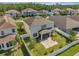 Aerial showcases the home's private, fenced backyard with patio area and established landscaping at 2348 Pearl Cider St, Orlando, FL 32824