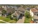 Aerial view of a well-manicured property in a residential community, featuring lush green lawns at 2348 Pearl Cider St, Orlando, FL 32824