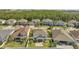 Aerial view of the property showcases the backyard, patio, and well-manicured lawn at 2348 Pearl Cider St, Orlando, FL 32824