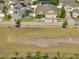 Aerial shot showcasing neighborhood homes near a soccer field at 2348 Pearl Cider St, Orlando, FL 32824