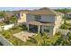 Aerial view reveals the spacious backyard with a brick patio, lush landscaping and privacy fence at 2348 Pearl Cider St, Orlando, FL 32824