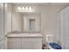 Practical bathroom featuring double sinks, toilet, shower, and neutral colors adding a clean feel at 2348 Pearl Cider St, Orlando, FL 32824