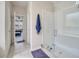 Bathroom with walk-in shower, neutral paint, and entrance leading to the bedroom at 2348 Pearl Cider St, Orlando, FL 32824