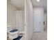 Hallway view of bathroom featuring shower, toilet, and neutral colors adding a clean feel at 2348 Pearl Cider St, Orlando, FL 32824