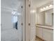 Bathroom featuring double sinks, tile floors, and adjacent room offering practicality and comfort at 2348 Pearl Cider St, Orlando, FL 32824
