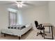 Well-lit bedroom featuring a ceiling fan, carpeted floors, and a comfortable single bed with work desk at 2348 Pearl Cider St, Orlando, FL 32824