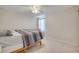 The bedroom features neutral carpeting, a ceiling fan, and a window offering plenty of natural light at 2348 Pearl Cider St, Orlando, FL 32824