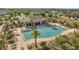 Community pool surrounded by lush landscaping offers a resort-style experience at 2348 Pearl Cider St, Orlando, FL 32824