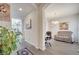 Hallway with views to office, dining area, and decorative artwork at 2348 Pearl Cider St, Orlando, FL 32824
