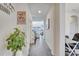 Hallway with views to the living room, dining area, and exercise room at 2348 Pearl Cider St, Orlando, FL 32824