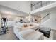 Open-concept living room with white sofa, high ceilings, and view of the kitchen and staircase at 2348 Pearl Cider St, Orlando, FL 32824