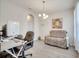 Open office with desk space, stylish sofa, and recessed lighting at 2348 Pearl Cider St, Orlando, FL 32824