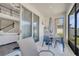 Covered patio with sliding glass doors and dining set provides seamless indoor/outdoor living at 2348 Pearl Cider St, Orlando, FL 32824