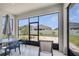 Screened patio featuring view of backyard, exterior space, and an outdoor seating area at 2348 Pearl Cider St, Orlando, FL 32824