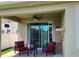 Covered patio with comfortable seating and a ceiling fan at 2522 Nouveau Way, Kissimmee, FL 34741