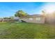 Well-maintained backyard featuring a large grassy area and secure wooden fence offering privacy at 2535 Georgia Ave, Sanford, FL 32773