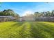 Expansive, grassy backyard with a full privacy fence surrounding the property at 2535 Georgia Ave, Sanford, FL 32773