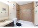 Bathroom featuring a shower-tub combination, tiled walls, and vanity at 2535 Georgia Ave, Sanford, FL 32773