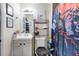 Bathroom with a large shower, decor, sink with cabinet and shelving unit for storage at 2535 Georgia Ave, Sanford, FL 32773