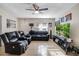 Inviting living room with neutral tones, tile floors, ceiling fan, and comfortable furnishings at 2535 Georgia Ave, Sanford, FL 32773