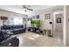 Cozy living room featuring tile floors, comfortable seating, and a bright, airy ambiance at 2535 Georgia Ave, Sanford, FL 32773
