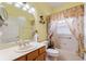 Bathroom featuring a vanity, decorative mirror, and shower-tub combo at 271 Falling Waters Dr, Kissimmee, FL 34759
