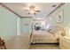 Large bedroom featuring a ceiling fan, carpet, and neutral color palette at 271 Falling Waters Dr, Kissimmee, FL 34759