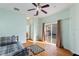 This bedroom features a bright window, an exterior sliding door and calming décor for a relaxing atmosphere at 271 Falling Waters Dr, Kissimmee, FL 34759