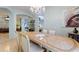 Open dining area with tile floors, chandelier, and natural light at 271 Falling Waters Dr, Kissimmee, FL 34759