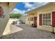 Outdoor patio, showing home's front entrance, windows with red shutters and outdoor hot tub at 271 Falling Waters Dr, Kissimmee, FL 34759