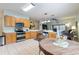Spacious eat-in kitchen featuring stainless steel appliances, wood cabinets, and tile flooring at 271 Falling Waters Dr, Kissimmee, FL 34759