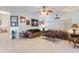 Open living room featuring tile floors, ceiling fan, and neutral walls, perfect for relaxation at 271 Falling Waters Dr, Kissimmee, FL 34759