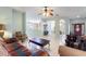 Spacious living room, tile floors, and open floor plan into kitchen and dinning room at 271 Falling Waters Dr, Kissimmee, FL 34759