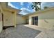 The home features a private outdoor patio with an access to an additional room at 271 Falling Waters Dr, Kissimmee, FL 34759
