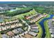 Scenic aerial view showcasing a community with beautiful lakes, lush greenery, and a golf course at 2724 Palm Tree Dr, Poinciana, FL 34759