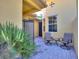 Outdoor patio with two chairs and a small table at 2724 Palm Tree Dr, Poinciana, FL 34759