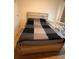 Bedroom boasts a bed with a headboard and a crib at 3041 Tobago Dr, Haines City, FL 33844