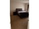 Cozy bedroom with carpet flooring and neutral walls for a relaxing ambiance at 3041 Tobago Dr, Haines City, FL 33844