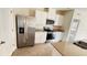 Well-equipped kitchen with stainless steel appliances and breakfast bar seating at 3041 Tobago Dr, Haines City, FL 33844