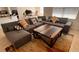 Living room with a sectional sofa, a coffee table, and a decorative rug at 3041 Tobago Dr, Haines City, FL 33844