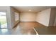 Neutral living room with breakfast bar, sliding door to backyard and lots of natural light at 3041 Tobago Dr, Haines City, FL 33844
