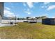 Expansive backyard featuring lawn, outdoor furniture, and a storage shed at 3111 Turnberry Blvd, Kissimmee, FL 34744