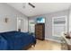Bedroom features tile flooring, fan, and a television atop a dresser at 3111 Turnberry Blvd, Kissimmee, FL 34744