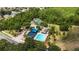 Aerial view of pool, clubhouse, playground, tennis court, and green space at 3111 Turnberry Blvd, Kissimmee, FL 34744