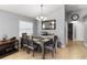 Dining area with stylish decor, a modern chandelier, and a large window for plenty of natural light at 3111 Turnberry Blvd, Kissimmee, FL 34744